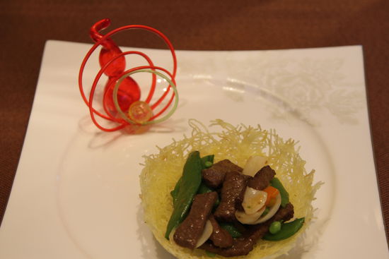 雀巢爆羊柳。 花惠生 供圖